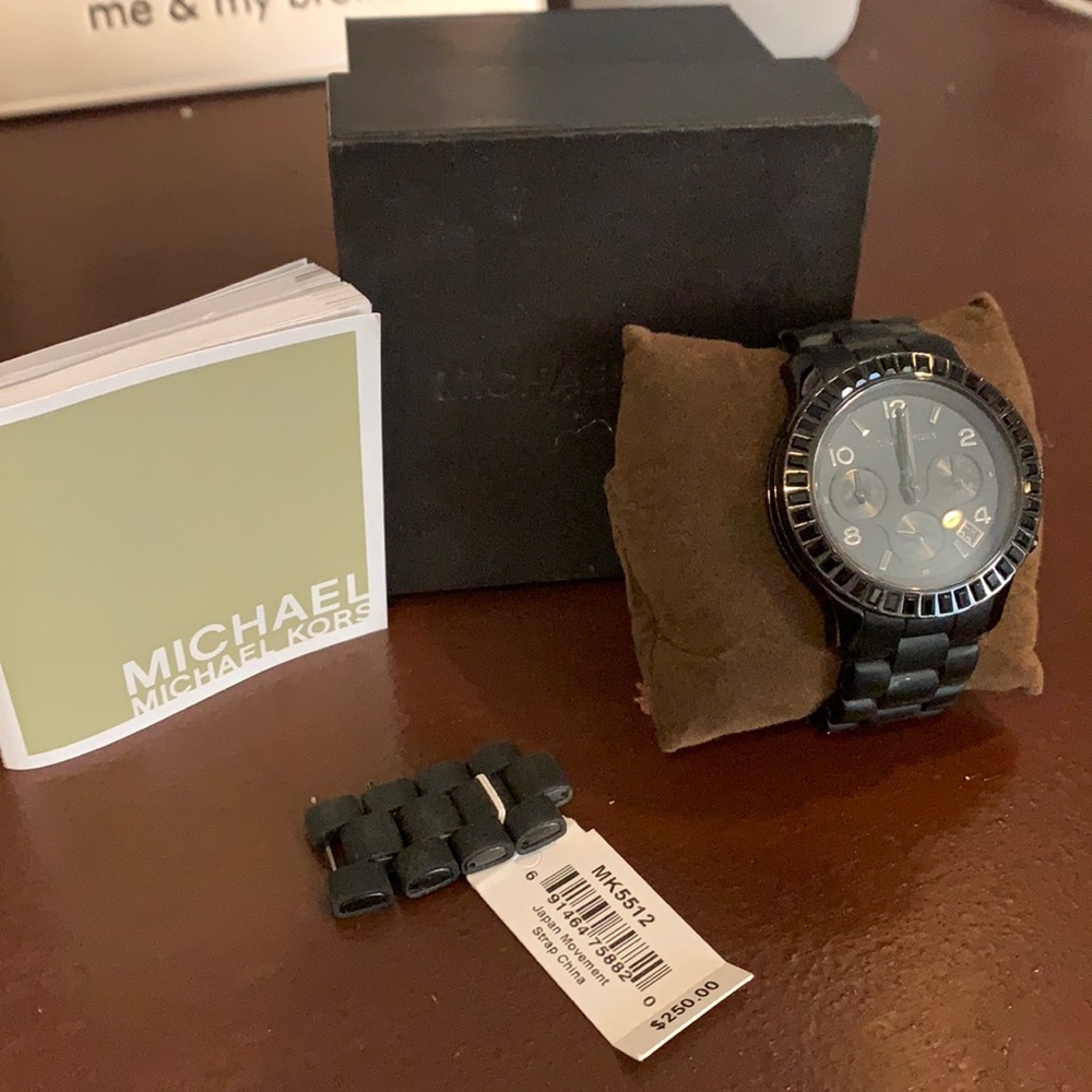 Black Michael Kors Watch. Comes with extra link